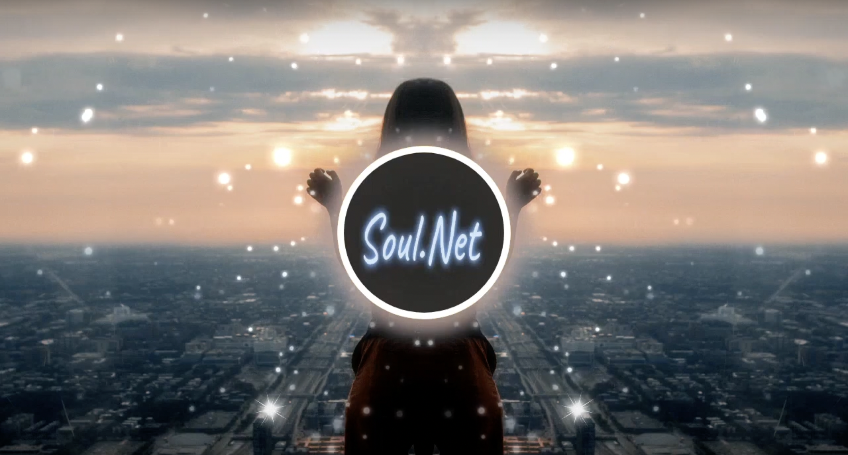 Soul.Net text in a circle, in front of a femme silhouette overlooking a city